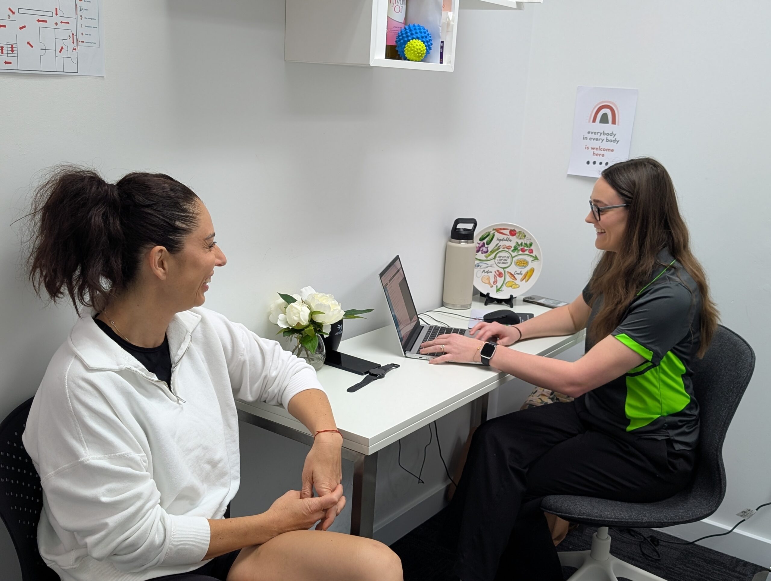 Accredited Practising Dietitian explaining body composition results to a client