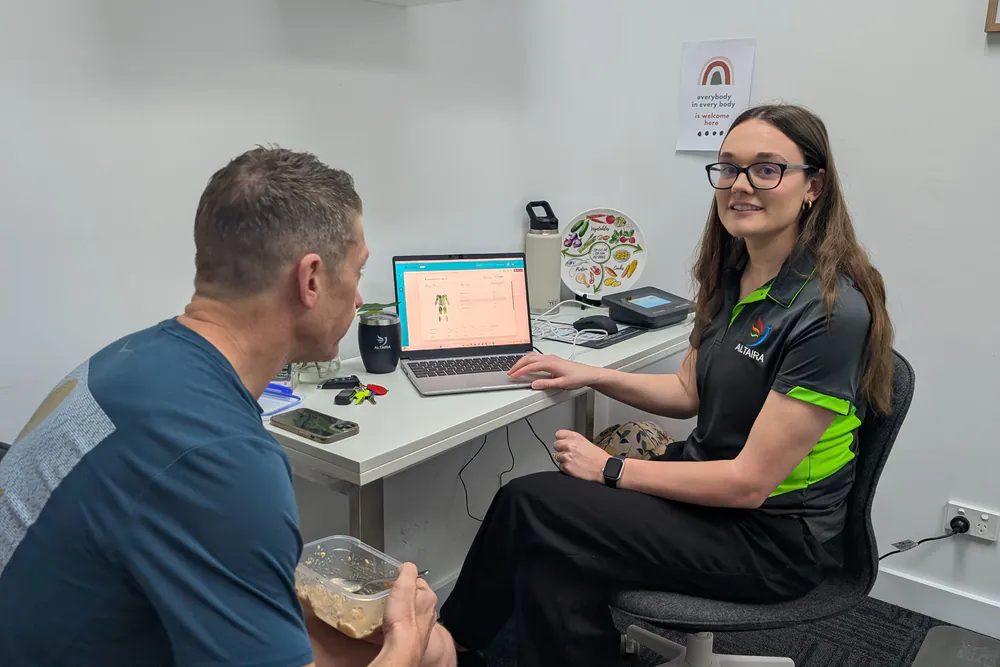 Accredited Practising Dietitian explaining body composition results to a client