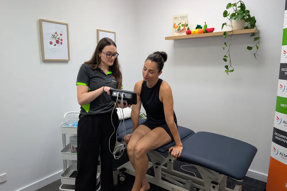 Client talking with the dietitian before a body composition scan