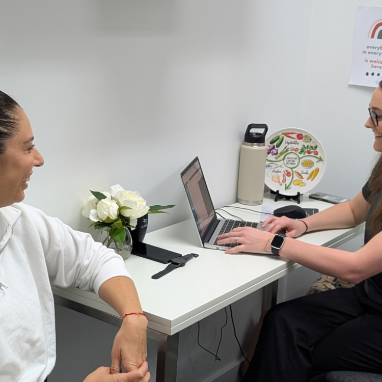 Dietitian Caitlin, with a client